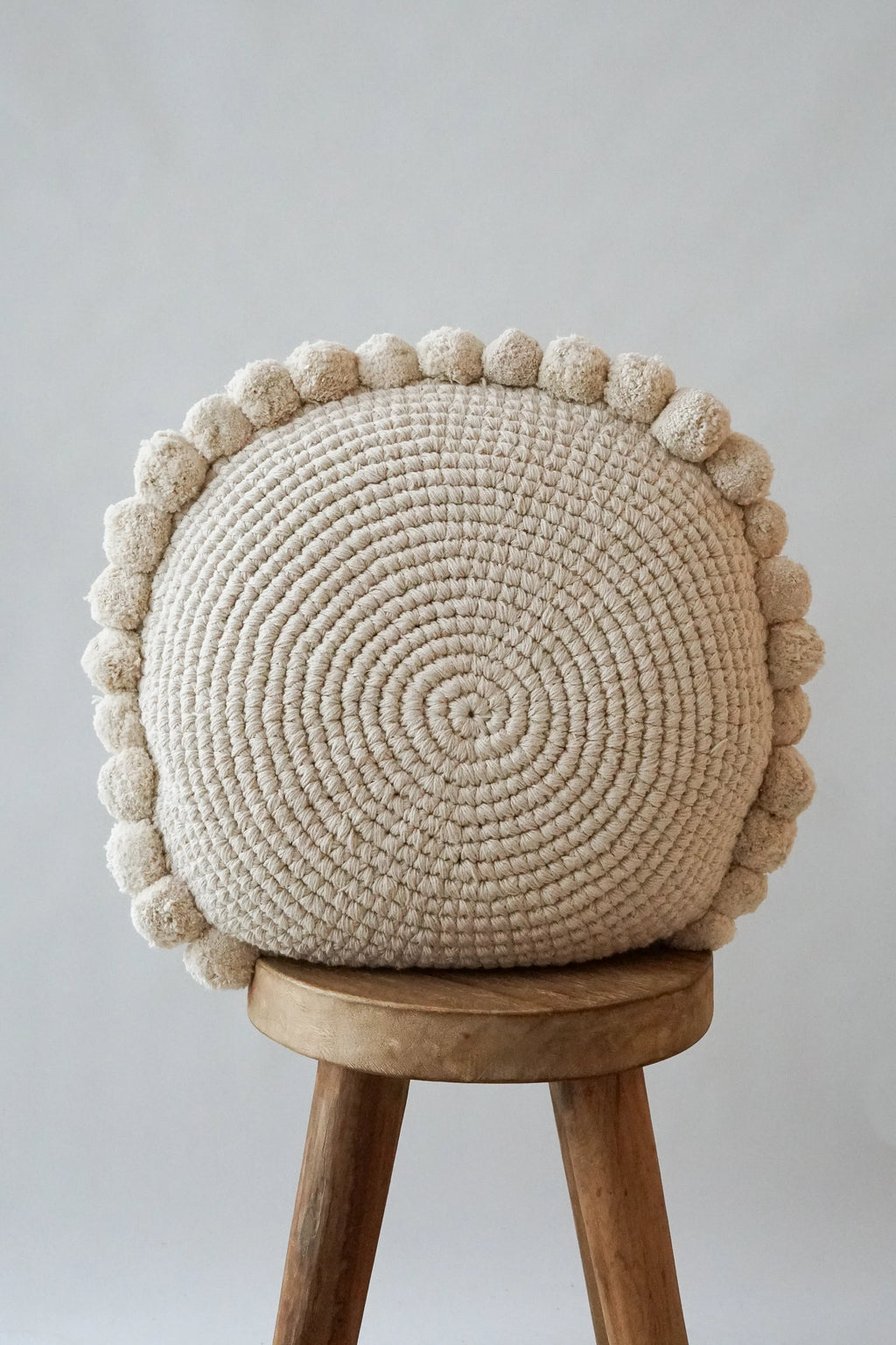 Luma Round Pom Pom Cushion in Natural