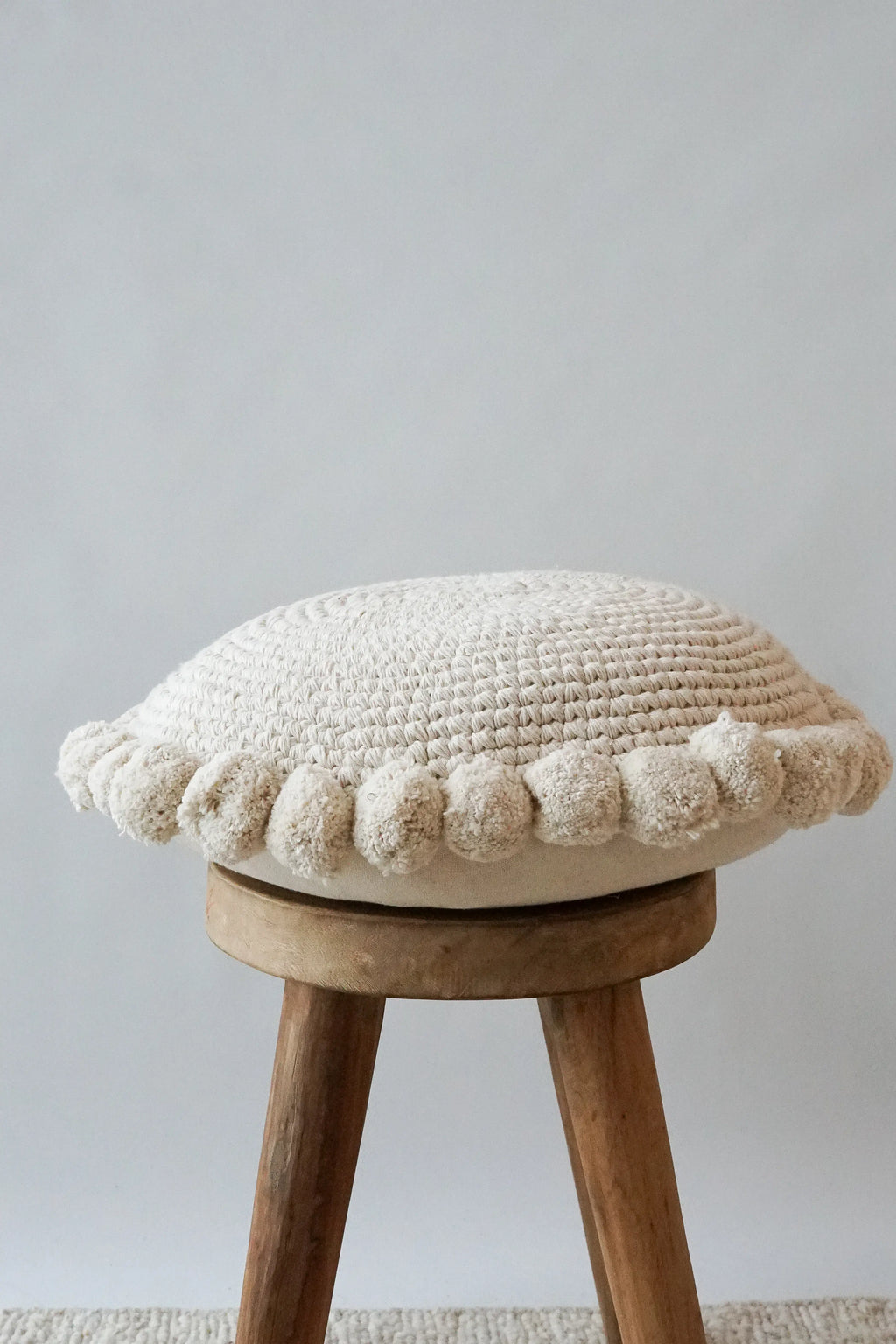 Luma Round Pom Pom Cushion in Natural