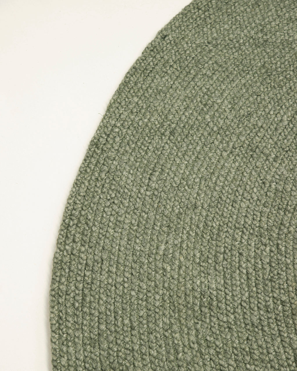 Jiva Round Braided Wool Rug in Olive