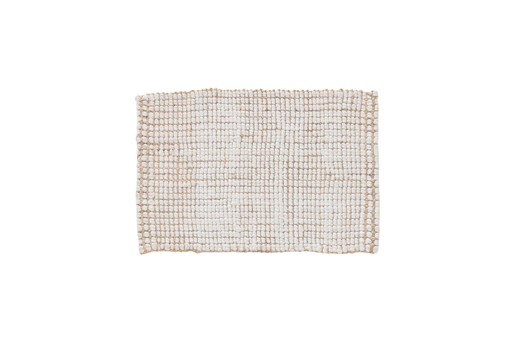 Textured woven mat on a white background